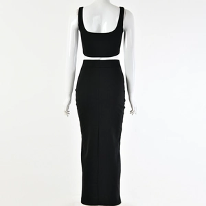 Rear view of a black two-piece set featuring a sleeveless crop top and high-waisted maxi skirt