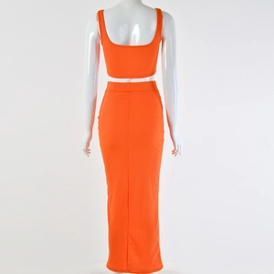 Back view of orange ribbed knit two-piece set featuring a crop top and long skirt