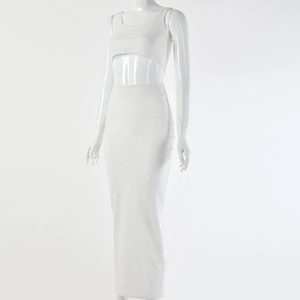 Detailed close-up of a white two-piece ribbed knit crop top and long skirt set for women