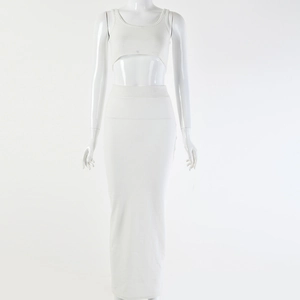 Close-up of white ribbed knit two-piece set featuring crop top and long skirt on a mannequin