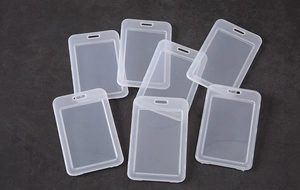 Detail showing semi-transparent frosted plastic card holders with lanyard holes for ID cards