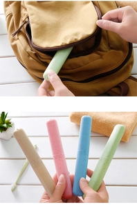 Portable wheat straw toothbrush travel cases in four colors stored in a backpack