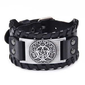 Vintage black leather bracelet featuring woven details and tree of life pentagram plaque