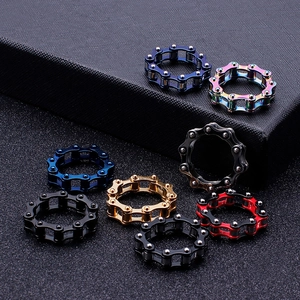 Industrial style titanium steel chain rings in gold, black, blue, and rainbow finishes