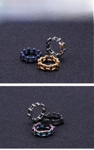 Detailed macro view of industrial style stainless steel chain rings in various metallic finishes