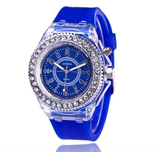 Close-up of blue silicone strap watch with rhinestone bezel and transparent case