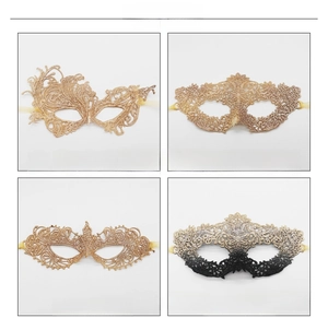 Detail of four lace masquerade mask styles including gold phoenix and floral patterns