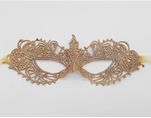 Detailed view of champagne gold lace eye mask with intricate embroidery for parties