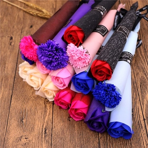 Detailed view of colorful soap rose and carnation bouquets wrapped in premium paper