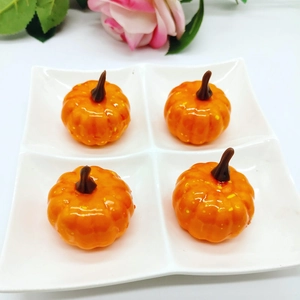 Set of four 5cm realistic orange foam pumpkins in a white tray for Christmas decoration