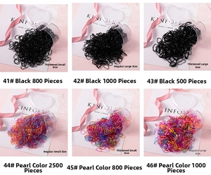 Divers élastiques à cheveux pour filles en noir et couleurs nacrées avec détails du lot