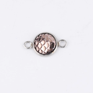Detail of 10mm rose gold scale texture charm in silver frame with side double loops