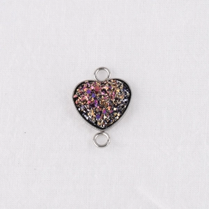 Detail of 13mm heart-shaped stainless steel pendant with glitter stones and dual loops