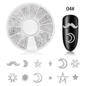 Nail art set with silver metal studs in stars and moons shapes with a 12-slot storage case