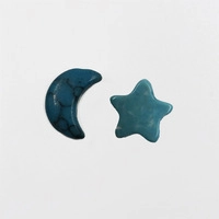 Detailed view of turquoise crescent moon and star shaped natural stone beads for DIY jewelry