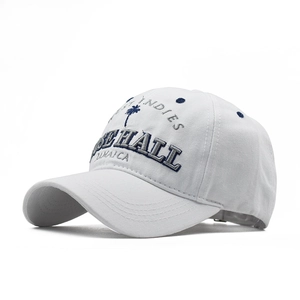 Close-up detail of a white cotton baseball cap featuring premium 3D palm tree embroidery