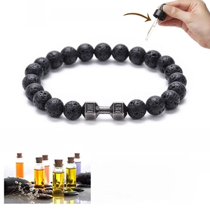 Lava stone bead bracelet with a silver dumbbell charm and essential oil diffuser function