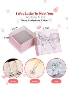 Detailed view of pink jewelry gift box with ribbon and interior compartments for accessories