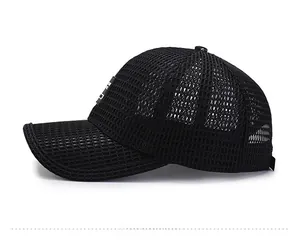 Detail view of black mesh baseball cap showing breathable texture and side fabric label