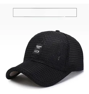 Detail of breathable black mesh fabric and rectangular logo patch on the baseball cap