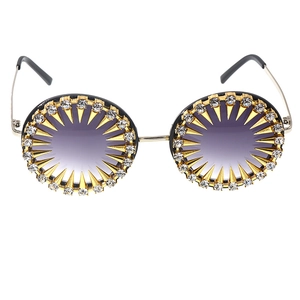 Vintage round sunglasses with purple gradient lenses and gold rhinestone spiked frames