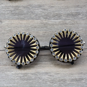 Retro round sunglasses with gold rivets and sparkling crystal rhinestones for a punk look