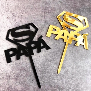 Detail of round acrylic Happy Birthday cake toppers in black and gold mirror finishes