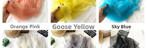 Detail view of lightweight semi-transparent sun protection chiffon scarves in multiple colors