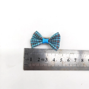 Blue plaid pet hair bow clip for dogs and cats with 3cm size measurement on white background