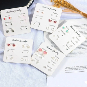Detailed set of six pairs of creative stud earrings featuring diverse shapes and colors