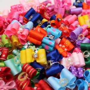Close-up of colorful handmade pet hair bows with pearls and rhinestone accents