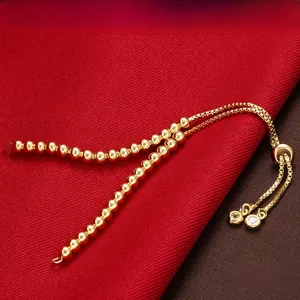 Adjustable 18K gold-plated beaded slider bracelet with shimmering zircon accents