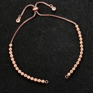 Detailed view of rose gold slider clasp bracelet with sparkling crystal charm accents