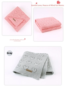 Detailed knit baby blanket with hollow heart patterns in soft pink and grey colors