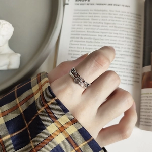 Detail of retro 925 silver double-layer ring with smile face and chain pattern