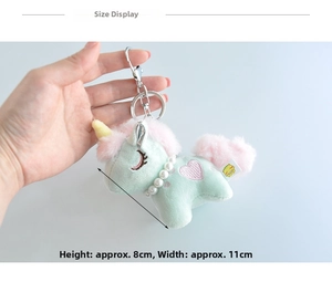 Detail view of mint green plush unicorn keychain with dimensions 8cm to 11cm high