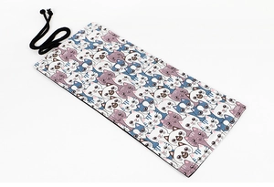Detailed view of canvas pencil roll organizer featuring cute cartoon cat patterns and tie strap