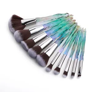 Close-up of 10-piece professional makeup brush set with crystal diamond handles