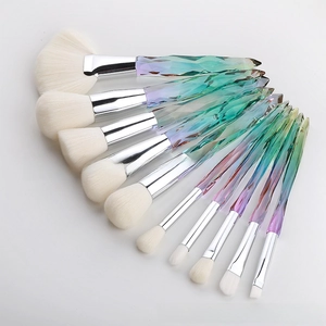 Detail view of 10-piece crystal makeup brushes with purple diamond-cut gradient handles