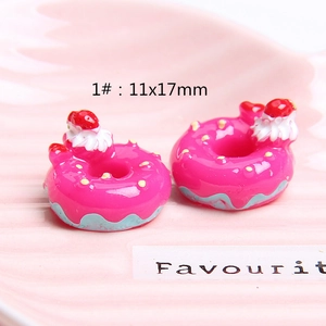 Detail showing 11x17mm resin donut charm with strawberry cream texture for DIY crafts