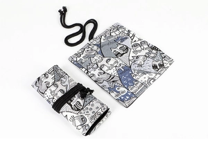 Detail of printed canvas pencil wrap featuring cute cat illustrations and black ties