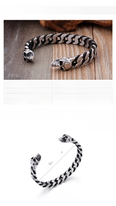 Detailed view of skull bangle with dimensions 66x10mm and 32g stainless steel specs