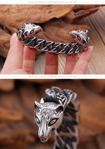 Detail of vintage wolf head steel bracelet featuring antique silver finish and woven texture