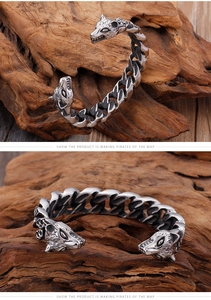 Close-up of vintage silver wolf head open cuff with thick cuban chain design details
