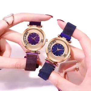 Detailed close-up of diamond studded ladies quartz watch with magnetic milanese strap