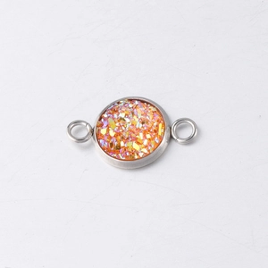 Macro view of 10mm stainless steel drusy connector with shimmering orange and gold glitter