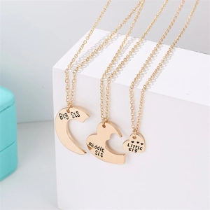 Three-piece gold heart puzzle necklace set with Big Middle and Little Sis engraving