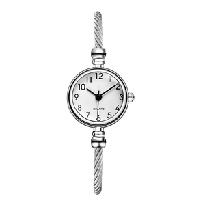 Detailed close-up of a silver steel wire rope bracelet watch with a white quartz dial