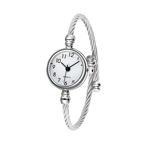 Detail of silver twisted cable bangle watch with a minimalist round white quartz dial