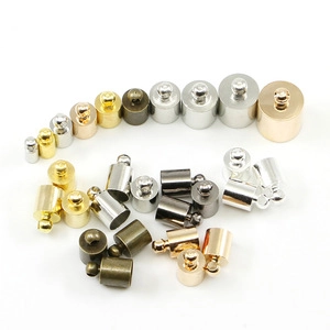 Close-up of multi-size metal slide tube end clasps for DIY jewelry in various colors